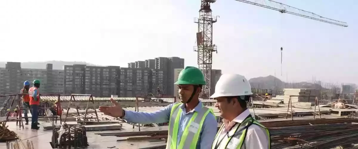 Project Manager explaining to PMC consultant
